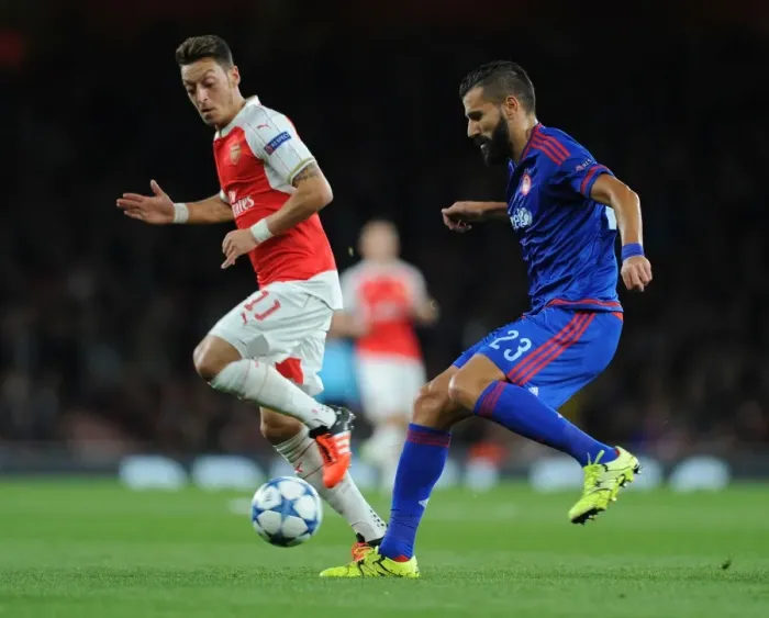 Framed Print : Mesut Ozil vs. Dimitris Siovas: Arsenal vs. Olympiacos Clash in 2015 / 16 UEFA Champions League Framed Print : Mesut Ozil vs. Dimitris Siovas: Arsenal vs. Olympiacos Clash in 2015 / 16 UEFA Champions League