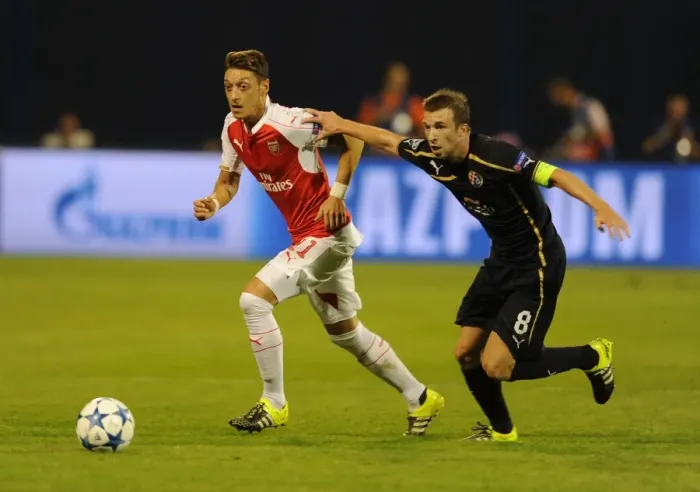 Framed Print : Mesut Ozil vs. Domagoj Antolic: Tense Clash in Dinamo Zagreb vs. Arsenal UEFA Champions League Match, 2015