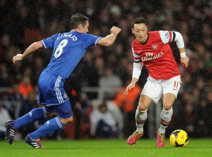 Framed Print : Mesut Ozil vs. Frank Lampard: A Premier League Rivalry - Arsenal vs. Chelsea (2013-14): Clash of Midfield Maestros