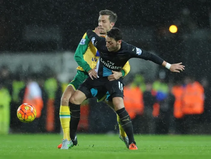Framed Print : Mesut Ozil vs. Gary O'Neil: A Football Rivalry Unfolds at Carrow Road Framed Print : Mesut Ozil vs. Gary O'Neil: A Football Rivalry Unfolds at Carrow Road