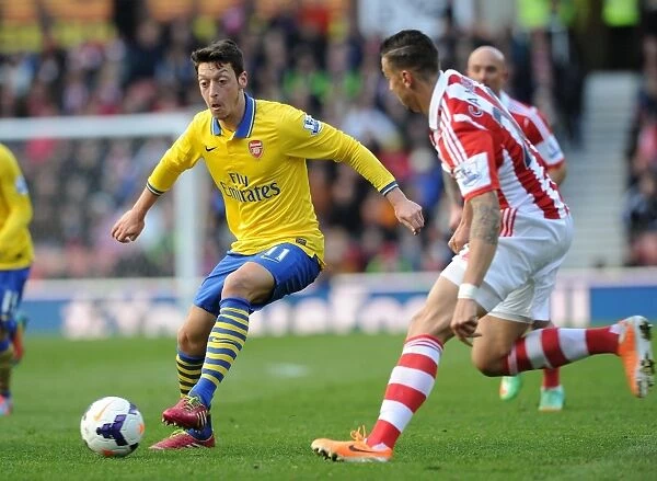 Mesut Ozil vs. Geoff Cameron: Clash at Britannia Stadium - Stoke City vs. Arsenal, Premier League 2013-14