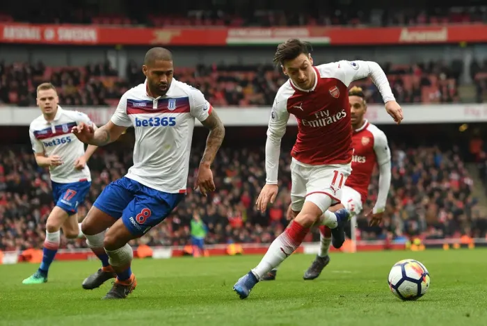 Framed Print : Mesut Ozil vs Glen Johnson: A Premier League Battle at Emirates Stadium Framed Print : Mesut Ozil vs Glen Johnson: A Premier League Battle at Emirates Stadium