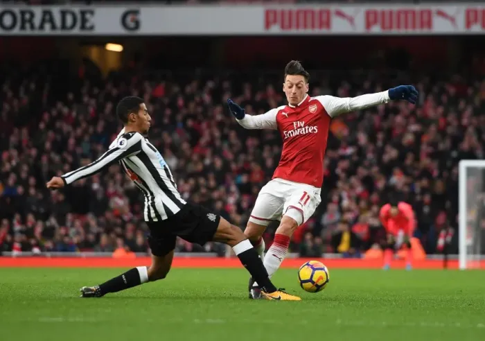 Framed Print : Mesut Ozil vs. Isaac Hayden: Intense Battle at Arsenal's Emirates Stadium (Arsenal v Newcastle United 2017-18)