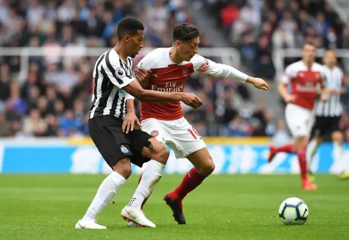 Framed Print : Mesut Ozil vs. Isaac Hayden: Clash at St. James Park - Newcastle United vs. Arsenal FC, Premier League 2018-19