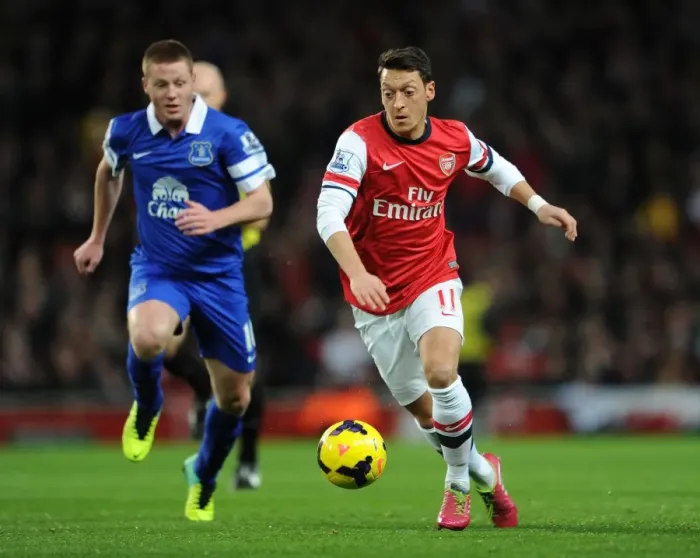 Framed Print : Mesut Ozil vs James McCarthy: Intense Battle at Arsenal v Everton, Premier League 2013-14