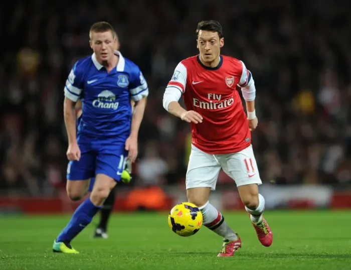 Framed Print : Mesut Ozil vs. James McCarthy: A Premier League Showdown at Arsenal
