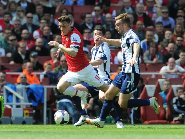 Framed Print : Mesut Ozil vs James Morrison: Intense Battle at Arsenal vs West Bromwich Albion (2013-14) Framed Print : Mesut Ozil vs James Morrison: Intense Battle at Arsenal vs West Bromwich Albion (2013-14)