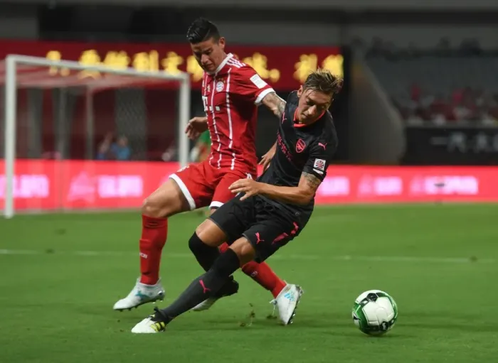 Framed Print : Mesut Ozil vs James Rodriguez: Battle in Shanghai - Bayern Munich vs Arsenal Pre-Season Clash Framed Print : Mesut Ozil vs James Rodriguez: Battle in Shanghai - Bayern Munich vs Arsenal Pre-Season Clash