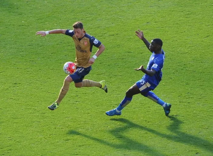 Framed Print : Mesut Ozil vs Jeffrey Schlupp: A Premier League Battle Framed Print : Mesut Ozil vs Jeffrey Schlupp: A Premier League Battle