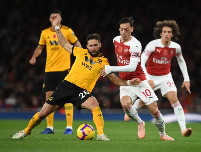 Framed Print : Mesut Ozil vs. Joao Moutinho: A Premier League Showdown at Emirates Stadium Framed Print : Mesut Ozil vs. Joao Moutinho: A Premier League Showdown at Emirates Stadium