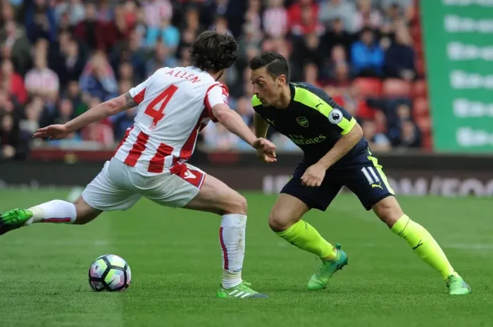 Framed Print : Mesut Ozil vs. Joe Allen: Clash of Midfield Titans - Stoke City vs. Arsenal, Premier League 2016-17