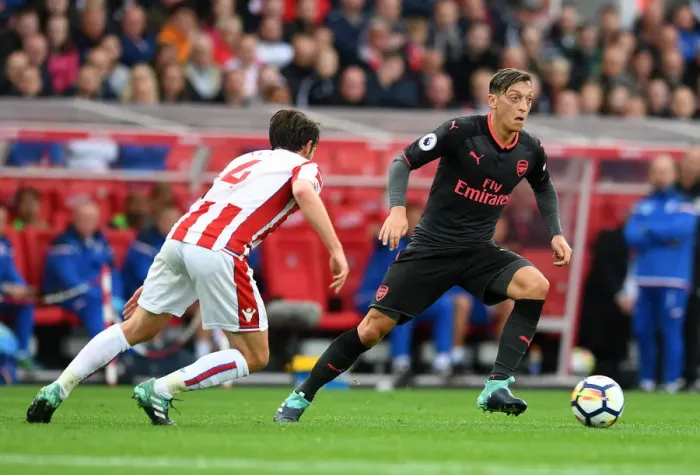 Framed Print : Mesut Ozil vs Joe Allen: Intense Battle in Stoke City vs Arsenal Premier League Clash Framed Print : Mesut Ozil vs Joe Allen: Intense Battle in Stoke City vs Arsenal Premier League Clash