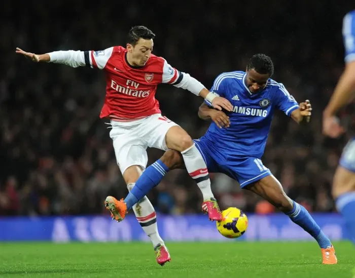 Framed Print : Mesut Ozil vs. John Obi Mikel: Intense Battle at Arsenal v Chelsea (Premier League 2013-14) Framed Print : Mesut Ozil vs. John Obi Mikel: Intense Battle at Arsenal v Chelsea (Premier League 2013-14)