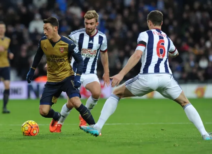 Framed Print : Mesut Ozil vs Jonny Evans: A Football Battle at The Hawthorns - Arsenal vs West Bromwich Albion (2015-16)
