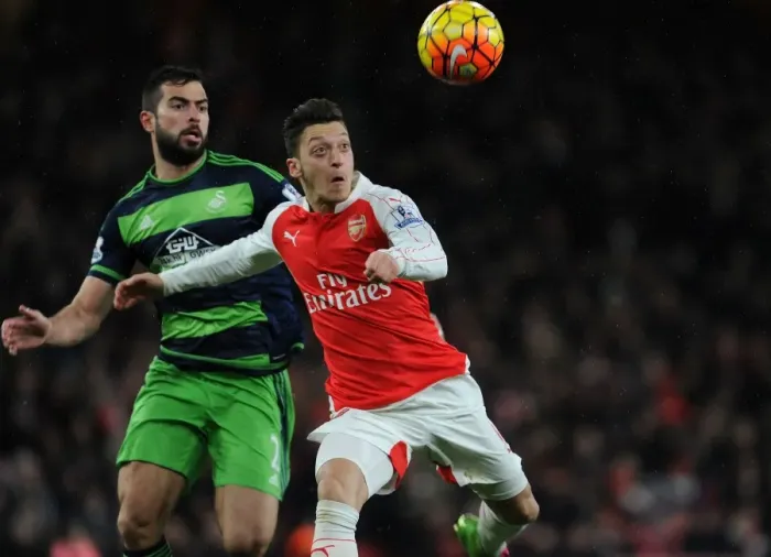 Framed Print : Mesut Ozil vs Jordi Amat: Intense Battle at the Emirates during Arsenal vs Swansea Clash (2015-16)