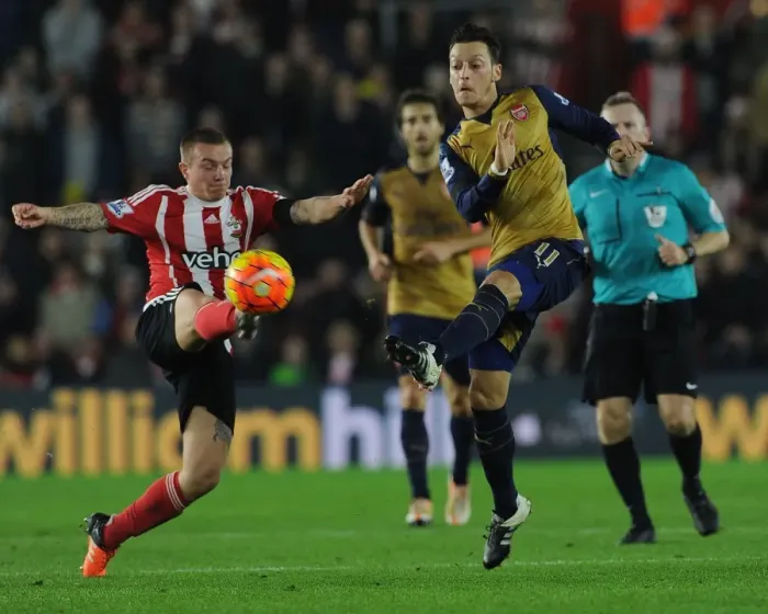 Framed Print : Mesut Ozil vs Jordy Clasie: A Premier League Showdown at Southampton's St Marys Stadium - Arsenal vs Southampton (2015-16)