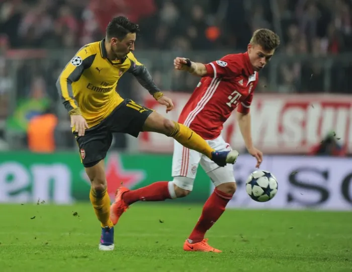 Framed Print : Mesut Ozil vs Joshua Kimmich: Battle in the UEFA Champions League - Bayern Munich vs Arsenal