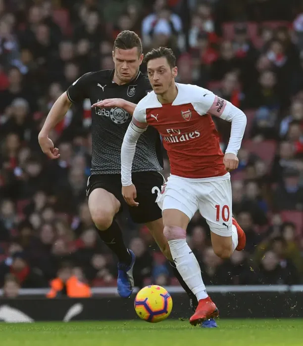Framed Print : Mesut Ozil vs. Kevin Long: Arsenal FC vs. Burnley FC, Premier League Showdown Framed Print : Mesut Ozil vs. Kevin Long: Arsenal FC vs. Burnley FC, Premier League Showdown