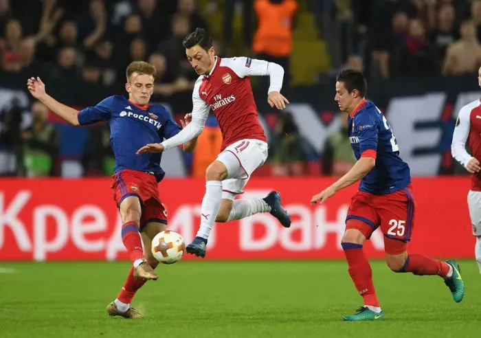Framed Print : Mesut Ozil vs. Konstantin Kuchaev: A Battle in the Europa League Quarterfinals between CSKA Moscow and Arsenal FC Framed Print : Mesut Ozil vs. Konstantin Kuchaev: A Battle in the Europa League Quarterfinals between CSKA Moscow and Arsenal FC