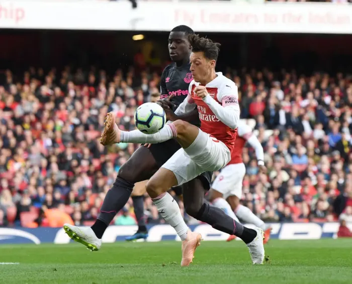 Framed Print : Mesut Ozil vs Kurt Zouma: A Midfield Duel at Emirates Stadium - Arsenal vs Everton, Premier League 2018-19