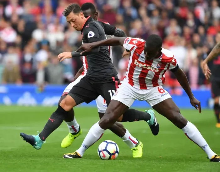 Framed Print : Mesut Ozil vs Kurt Zouma: A Premier League Face-Off Framed Print : Mesut Ozil vs Kurt Zouma: A Premier League Face-Off