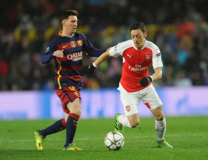 Framed Print : Mesut Ozil vs. Lionel Messi: A Champion's Battle - Arsenal vs. Barcelona