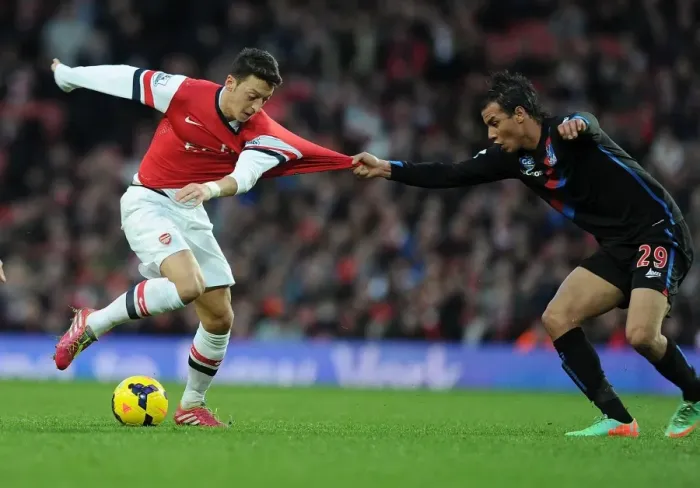 Framed Print : Mesut Ozil vs Marouane Chamakh: Intense Battle at Arsenal vs Crystal Palace, Premier League 2013-14