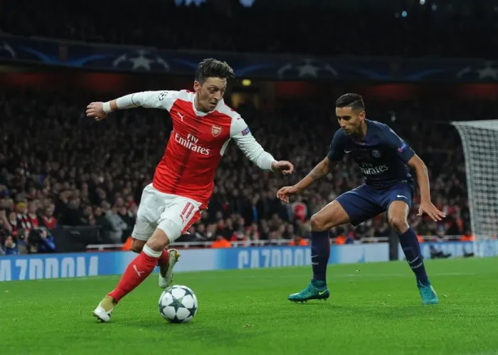 Framed Print : Mesut Ozil vs. Marquinhos: A Champions League Battle at Emirates Stadium