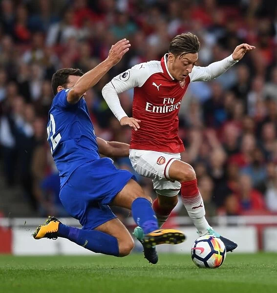 Mesut Ozil vs Matty James: A Premier League Battle at Arsenal