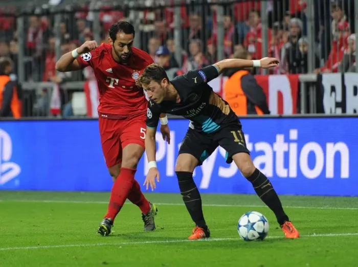 Framed Print : Mesut Ozil vs. Medhi Benatia: A Champions League Showdown Framed Print : Mesut Ozil vs. Medhi Benatia: A Champions League Showdown
