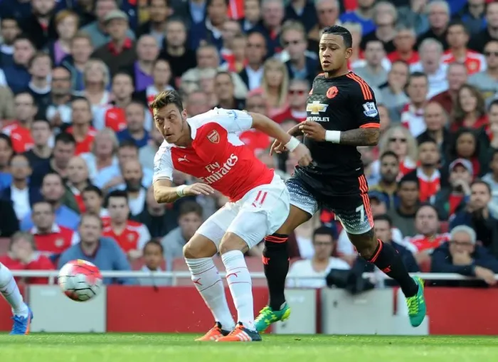 Framed Print : Mesut Ozil vs Memphis Depay: A Premier League Showdown at Arsenal Framed Print : Mesut Ozil vs Memphis Depay: A Premier League Showdown at Arsenal
