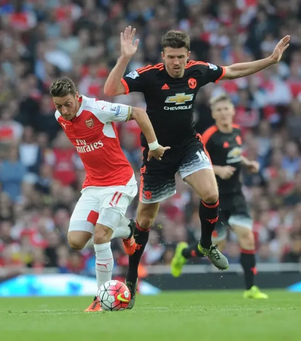 Framed Print : Mesut Ozil vs Michael Carrick: A Midfield Battle - Arsenal vs Manchester United (2015 / 16)