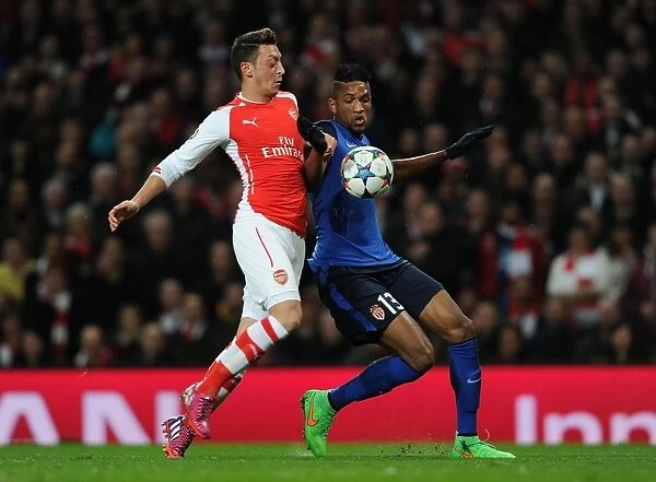 Mesut Ozil vs. Nabil Dirar: Intense Battle in Arsenal's UEFA Champions League Clash with Monaco