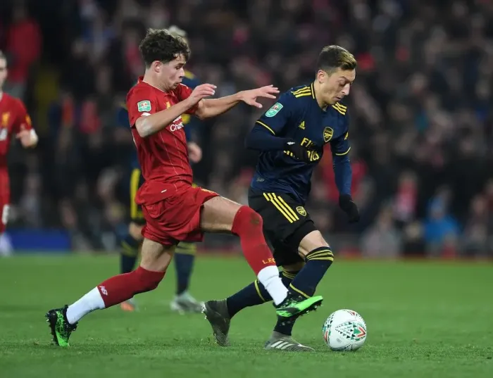 Framed Print : Mesut Ozil vs. Neco Williams: A Battle at Anfield in the Carabao Cup