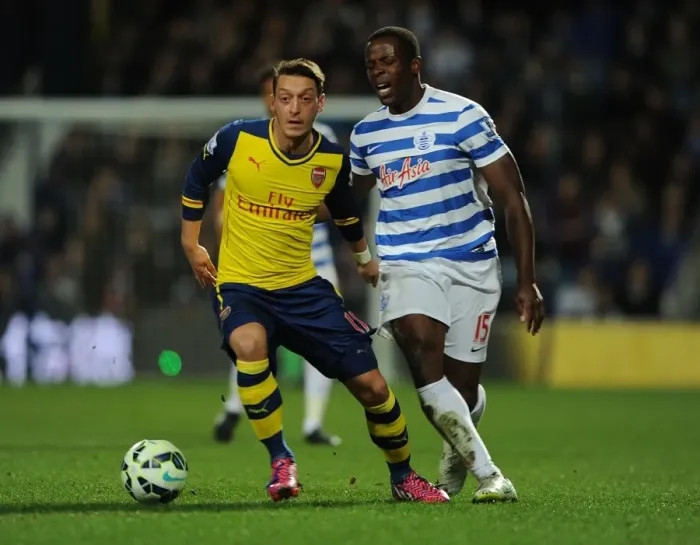 Framed Print : Mesut Ozil vs Nedum Onuoha: Intense Clash Between Queens Park Rangers and Arsenal in the Premier League Framed Print : Mesut Ozil vs Nedum Onuoha: Intense Clash Between Queens Park Rangers and Arsenal in the Premier League