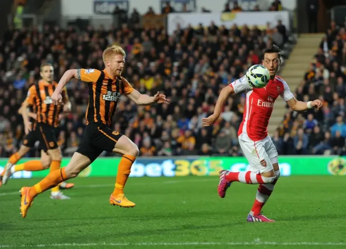 Framed Print : Mesut Ozil vs. Paul McShane: A Battle of Skills in the Intense Hull City vs. Arsenal Clash, Premier League 2014 / 15