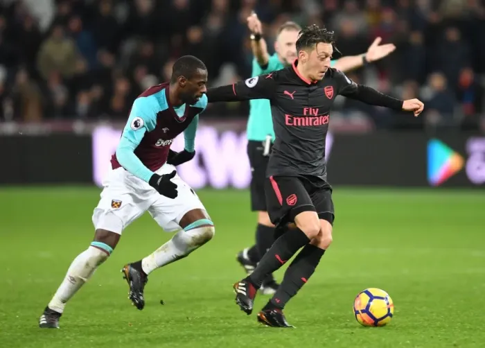 Framed Print : Mesut Ozil vs Pedro Obiang: Intense Clash in West Ham United vs Arsenal Premier League Match