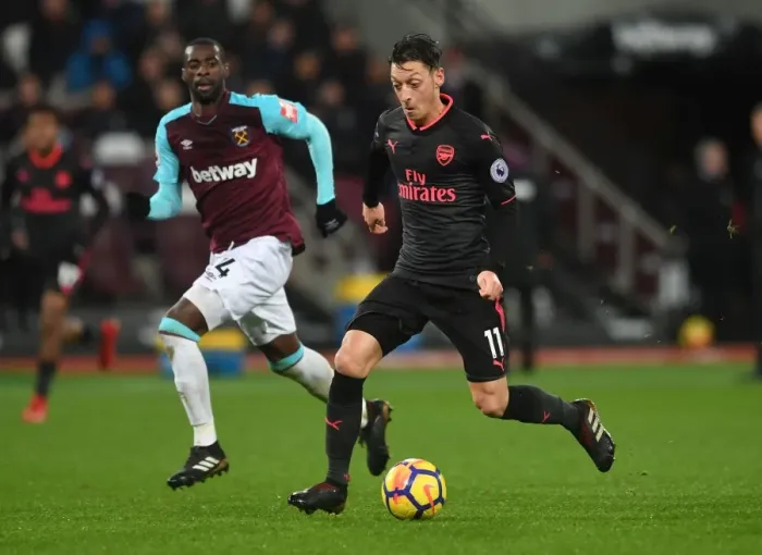 Framed Print : Mesut Ozil vs Pedro Obiang: A Premier League Battle