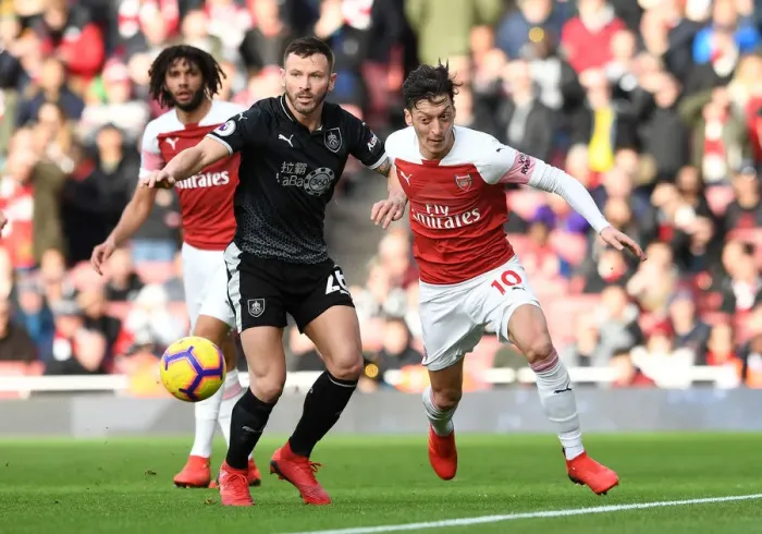 Framed Print : Mesut Ozil vs. Phil Bardsley: Battle for Ball Possession - Arsenal vs. Burnley, Premier League 2018-19