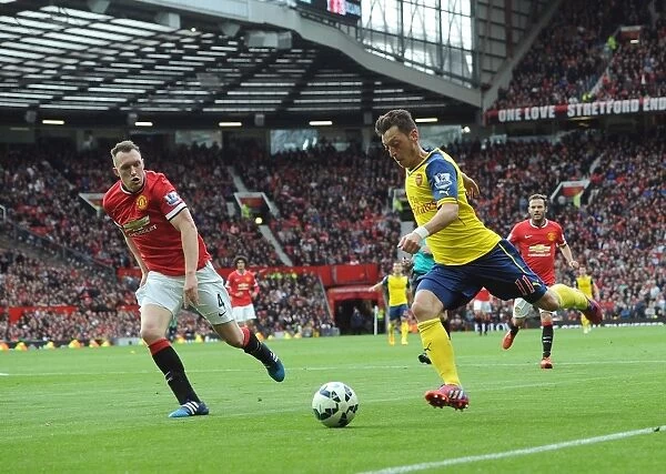 Mesut Ozil vs. Phil Jones: A Premier League Showdown at Old Trafford (Arsenal vs. Manchester United, 2014-15)