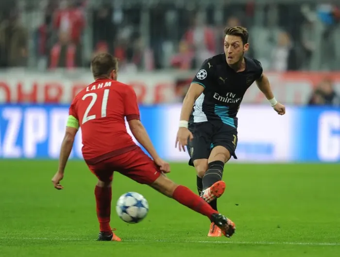 Framed Print : Mesut Ozil vs. Philipp Lahm: A Midfield Duel of Champions League Greats
