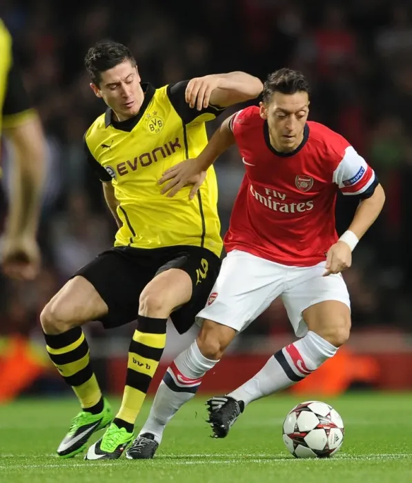 Framed Print : Mesut Ozil vs. Robert Lewandowski: A Battle at the Emirates - Arsenal v Borussia Dortmund, UEFA Champions League (2013)