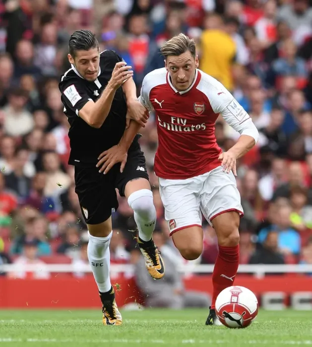 Framed Print : Mesut Ozil vs. Sergio Escudero: Arsenal vs. Sevilla - Emirates Cup Showdown