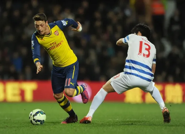 Framed Print : Mesut Ozil vs Suk-Young Yun: A Battle in the Premier League