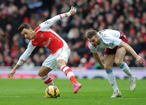 Mesut Ozil vs. Tom Cleverley: Intense Battle at the Emirates, Arsenal vs. Aston Villa, Premier League