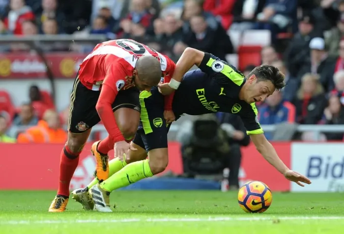 Framed Print : Mesut Ozil vs. Wahbi Khazri: Tense Moment in Sunderland vs. Arsenal Premier League Clash Framed Print : Mesut Ozil vs. Wahbi Khazri: Tense Moment in Sunderland vs. Arsenal Premier League Clash