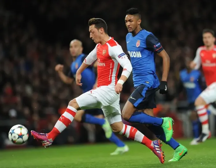 Framed Print : Mesut Ozil vs Wallace: Intense Battle in Arsenal's UEFA Champions League Clash Against AS Monaco Framed Print : Mesut Ozil vs Wallace: Intense Battle in Arsenal's UEFA Champions League Clash Against AS Monaco