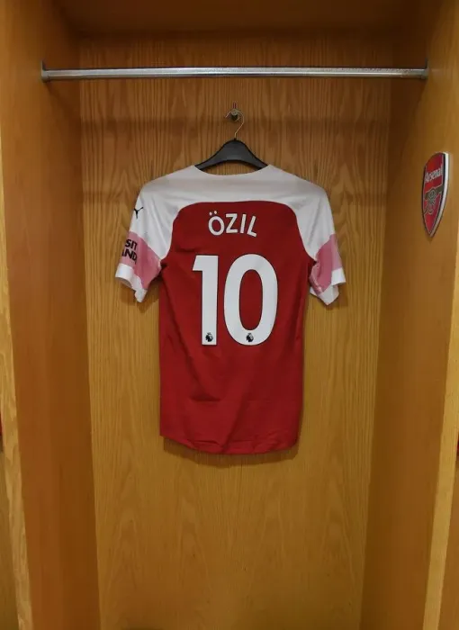 Framed Print : Mesut Ozil's Arsenal Jersey in Arsenal Dressing Room Before Arsenal v Chelsea Match