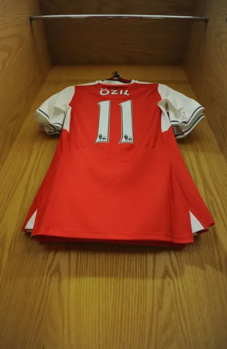 Framed Print : Mesut Ozil's Arsenal Shirt in Arsenal Changing Room Before Arsenal vs. Everton (2016-17)