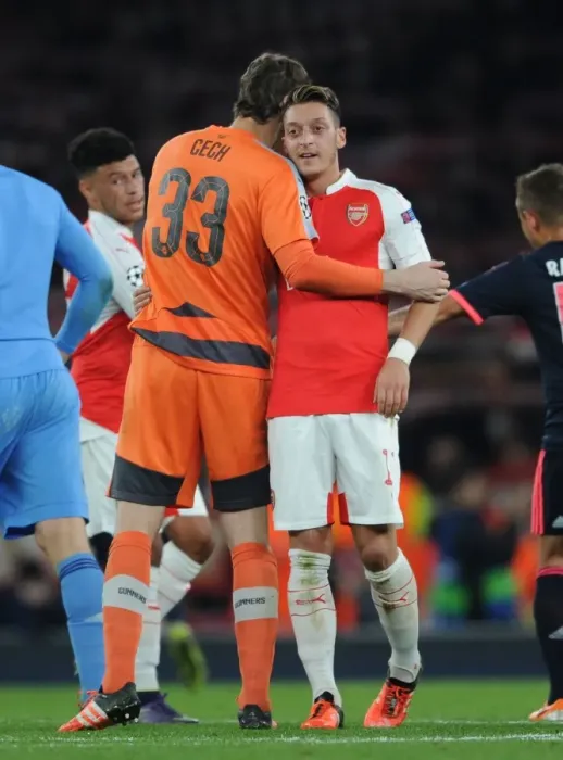 Framed Print : Mesut Ozil's Dramatic Late Goal: Arsenal Stuns Bayern Munich in Champions League Showdown